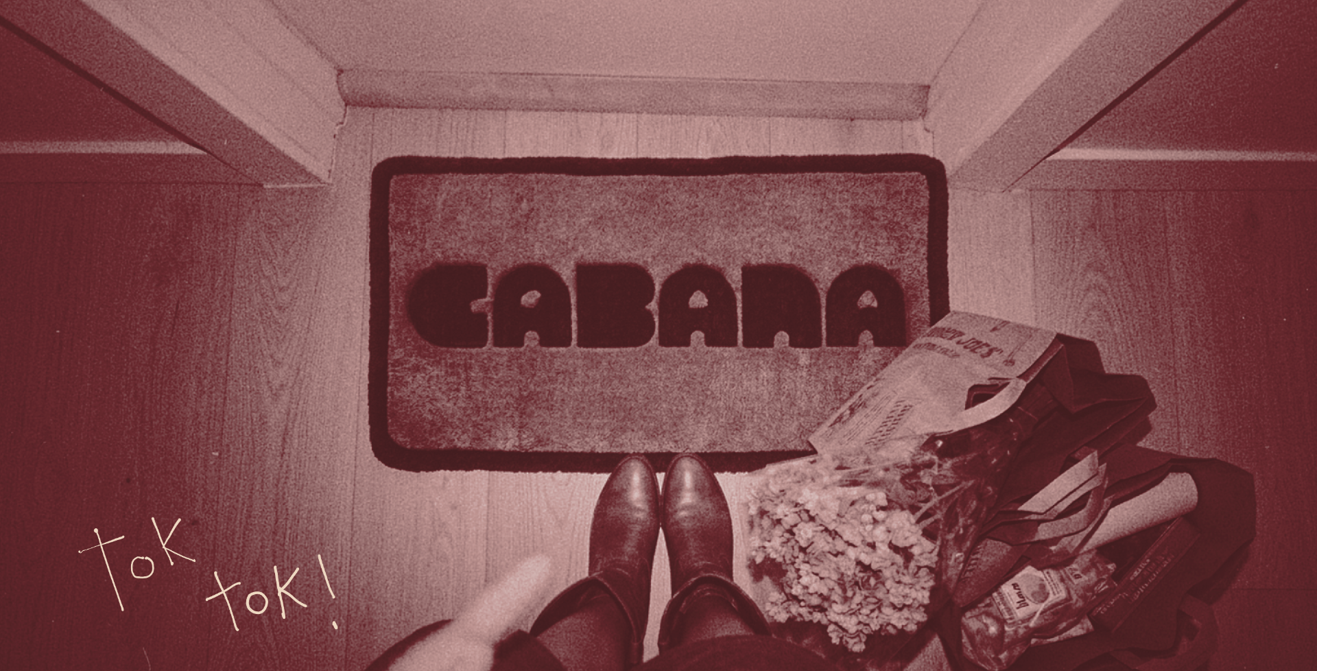 A doormat that reads CABANA with boots stepping onto it and tok tok handwritten in the corner